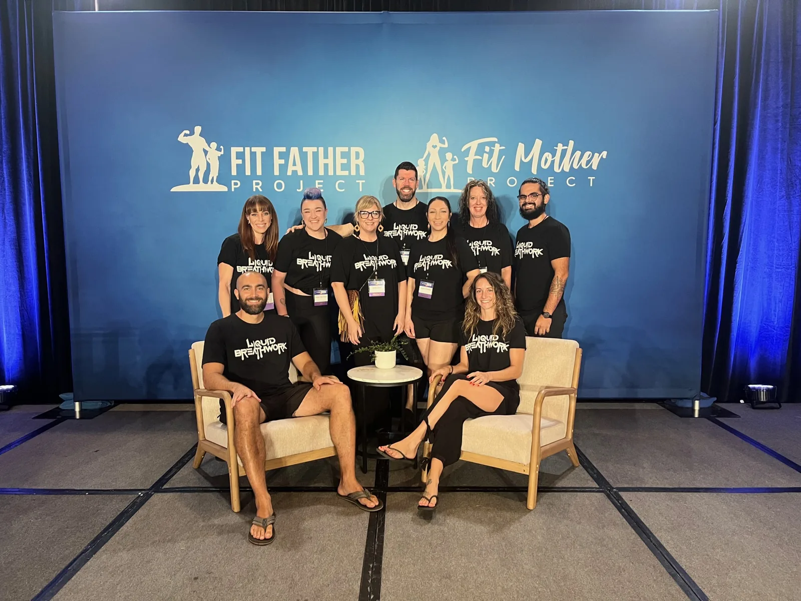 Liquid Breathwork at Fit Father Live 2026: Ryan, Shelby and graduate co-facilitators on the main stage
