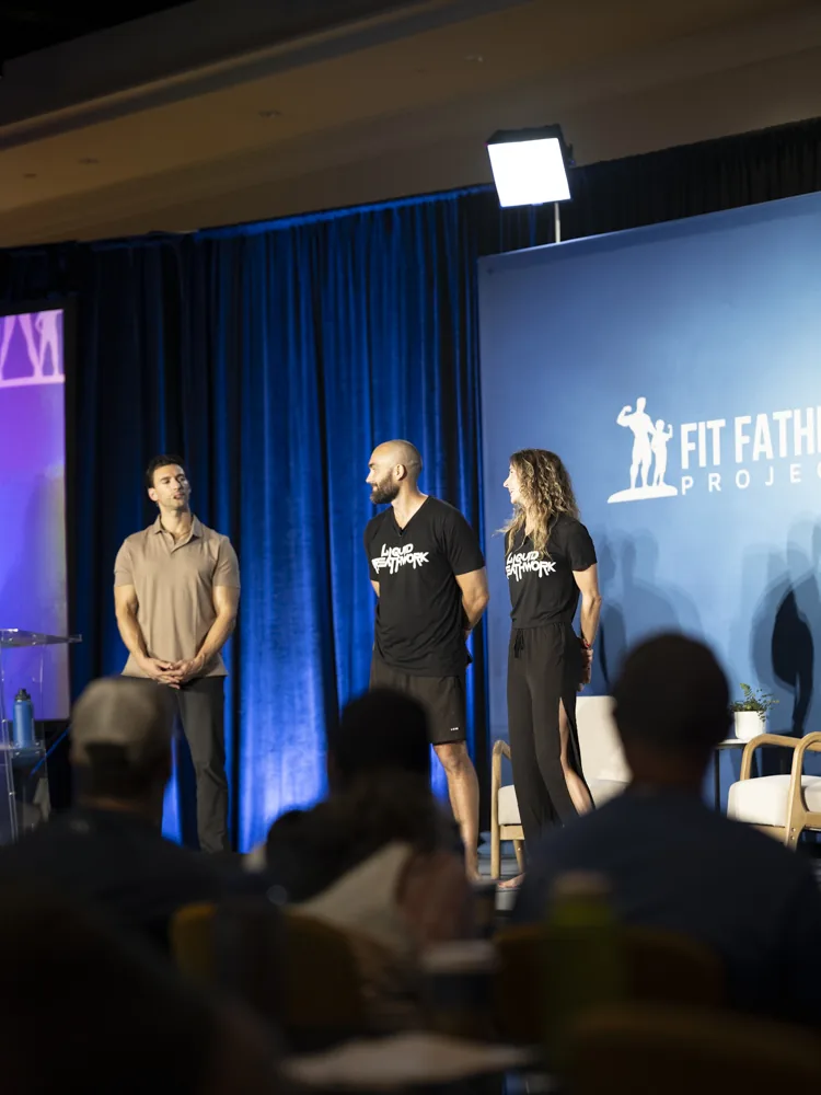 Ryan McBurney and Shelby Von Oepen on stage at the Fit Father Project conference