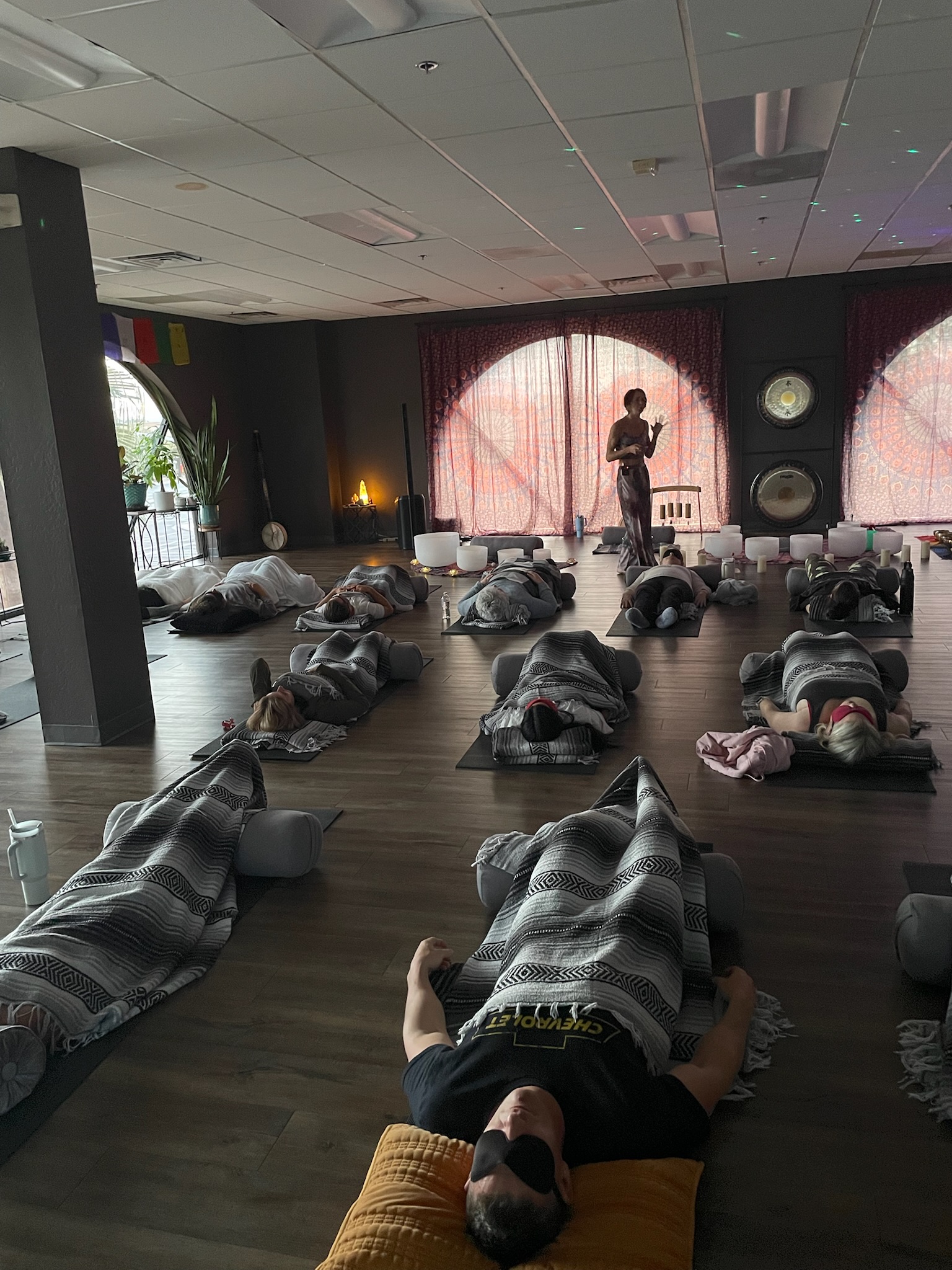 Somatic Breathwork session with participants lying down in surrender during guided practice