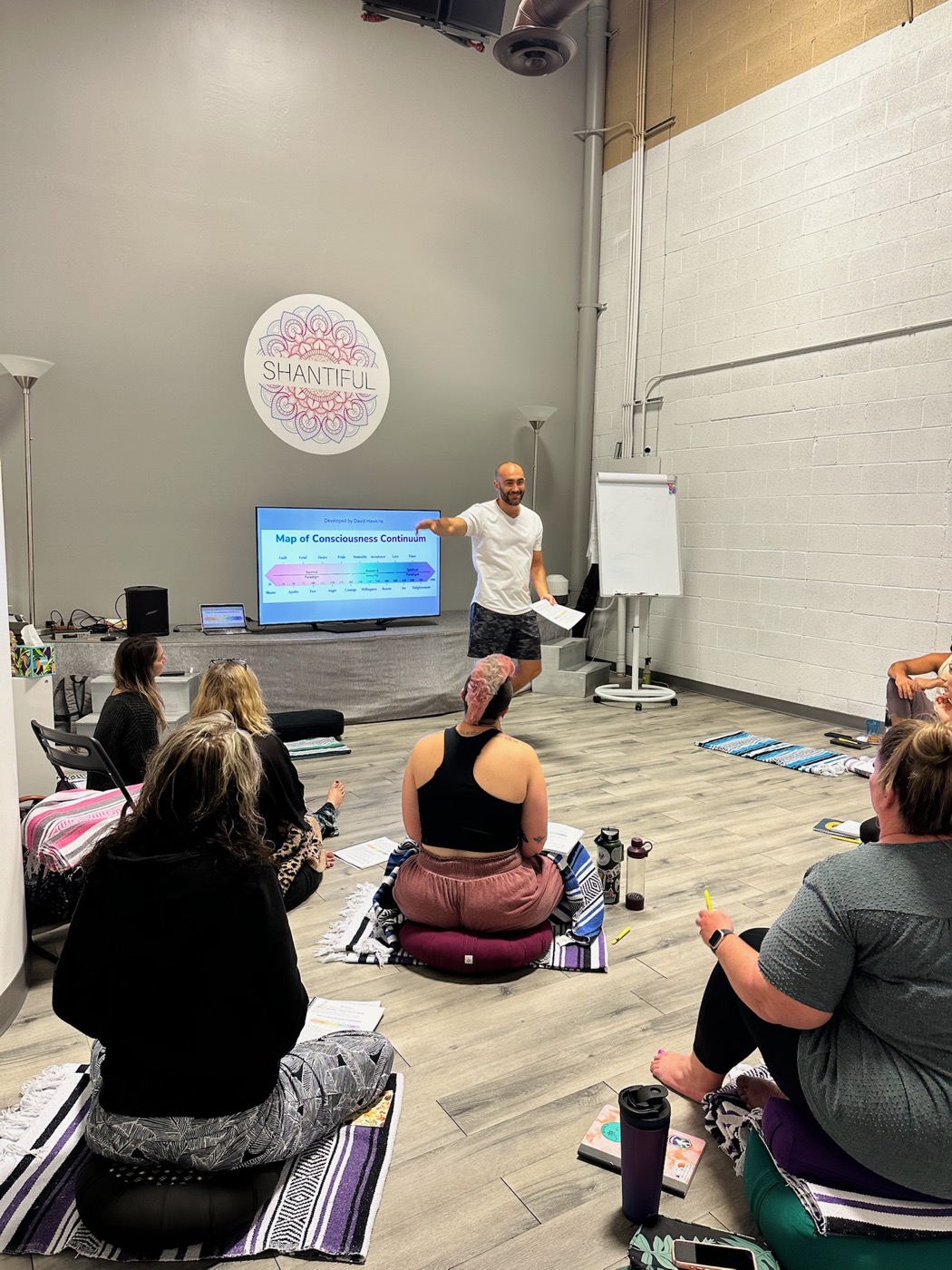 Liquid Breathwork facilitators connecting backstage before leading a group session at a health conference