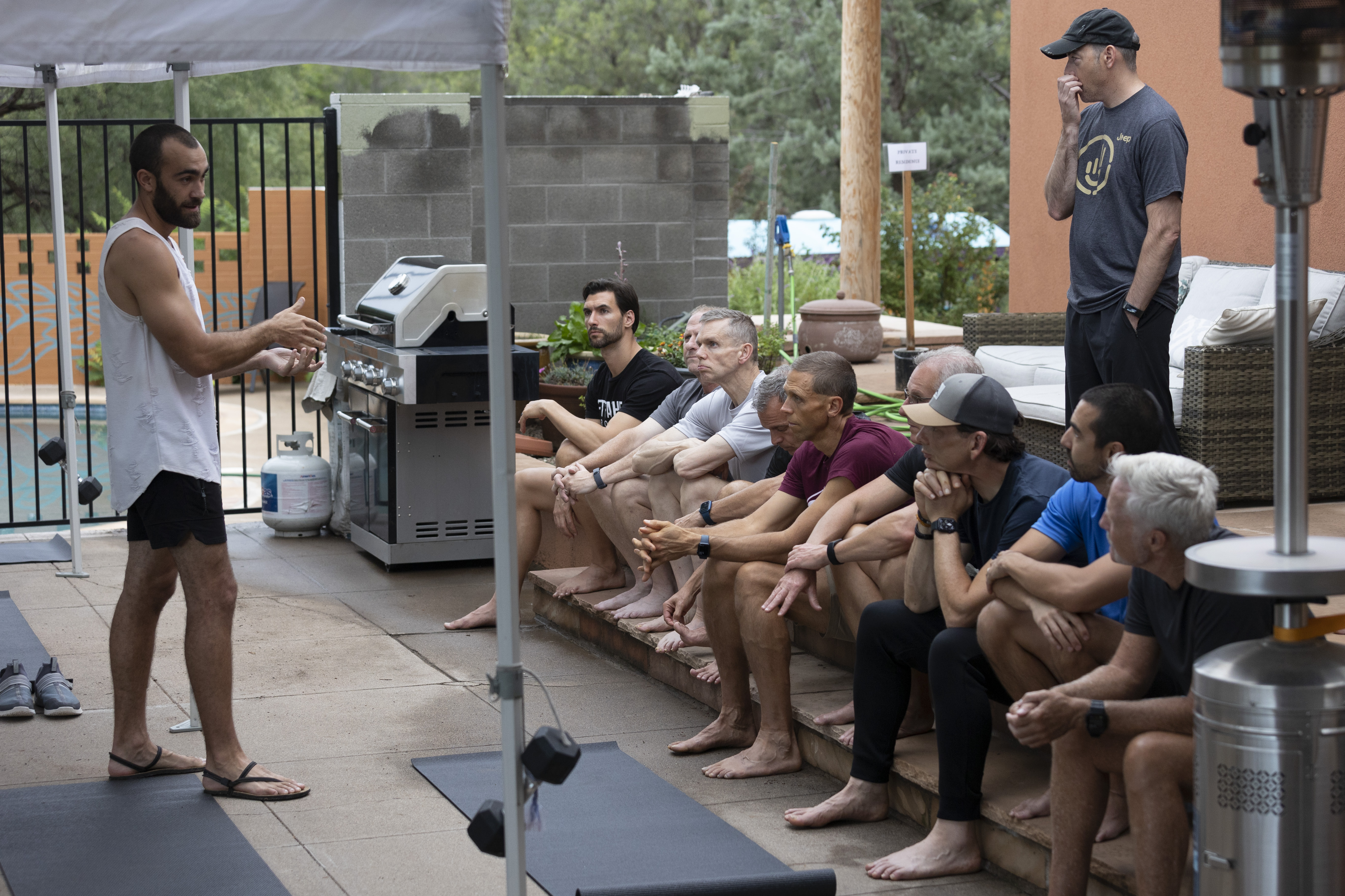 Ryan teaching breathwork techniques to retreat group