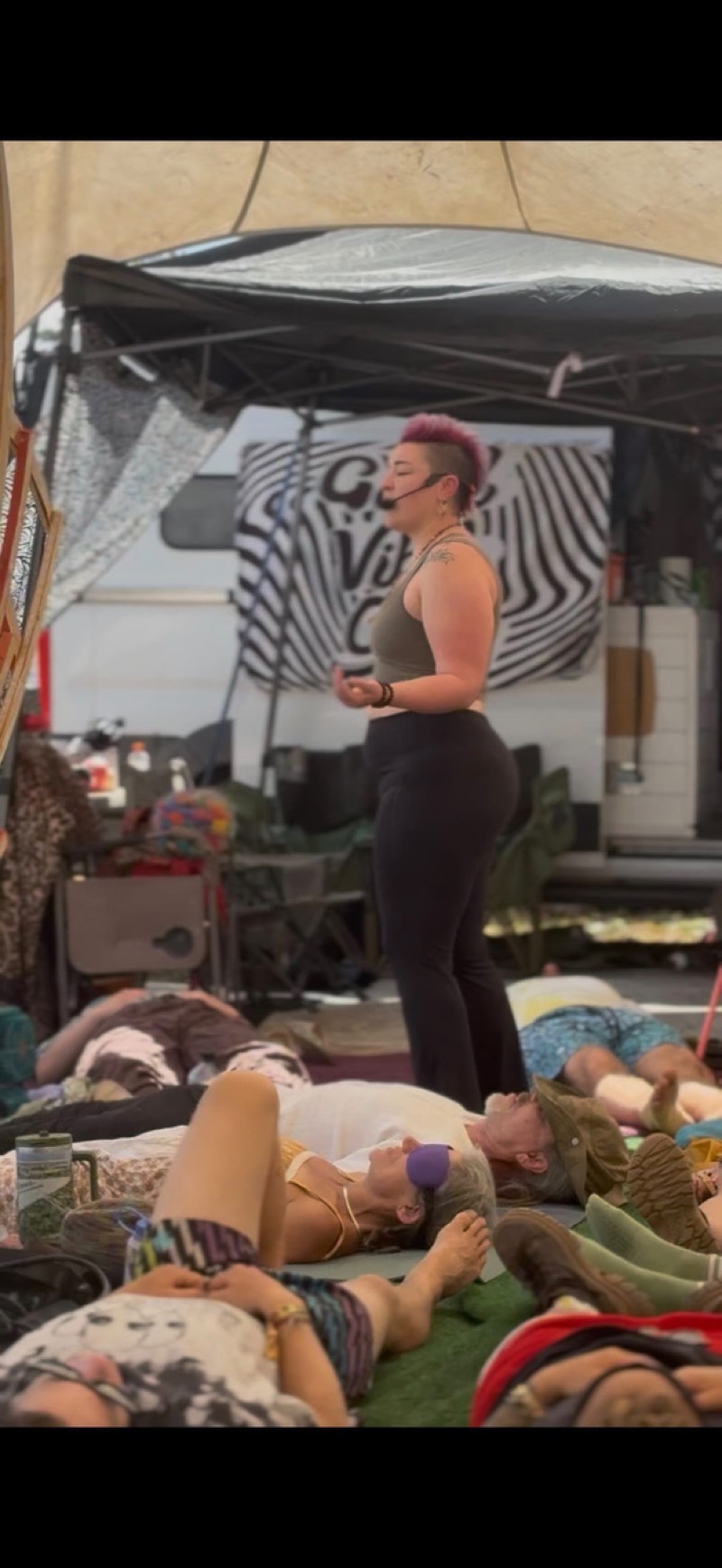 Kat McGill guiding a Breathwork session at a music festival