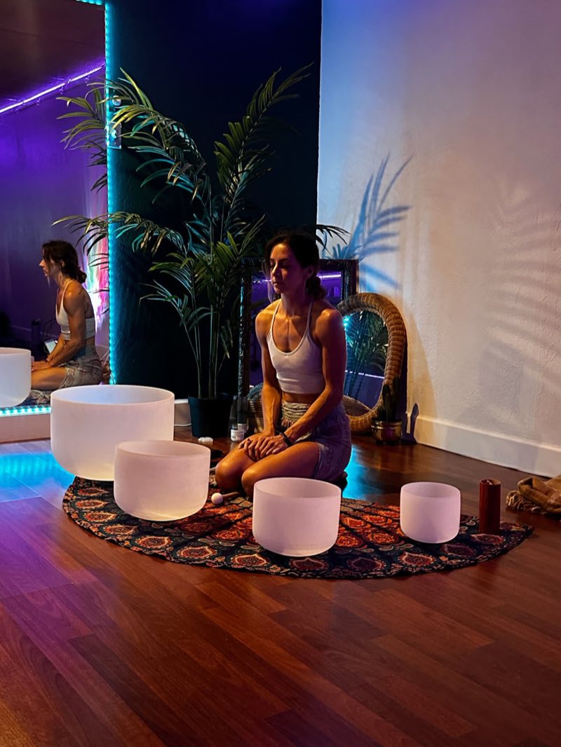 Shelby holding space at a Liquid Breathwork sound session