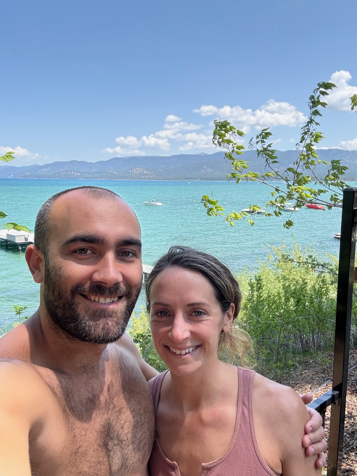 Ryan McBurney and Shelby Von Oepen of Liquid Breathwork at the turquoise shoreline of Lake Tahoe