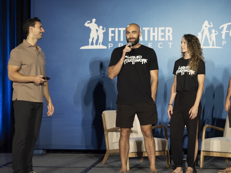 Ryan McBurney guiding Breathwork on stage at a conference