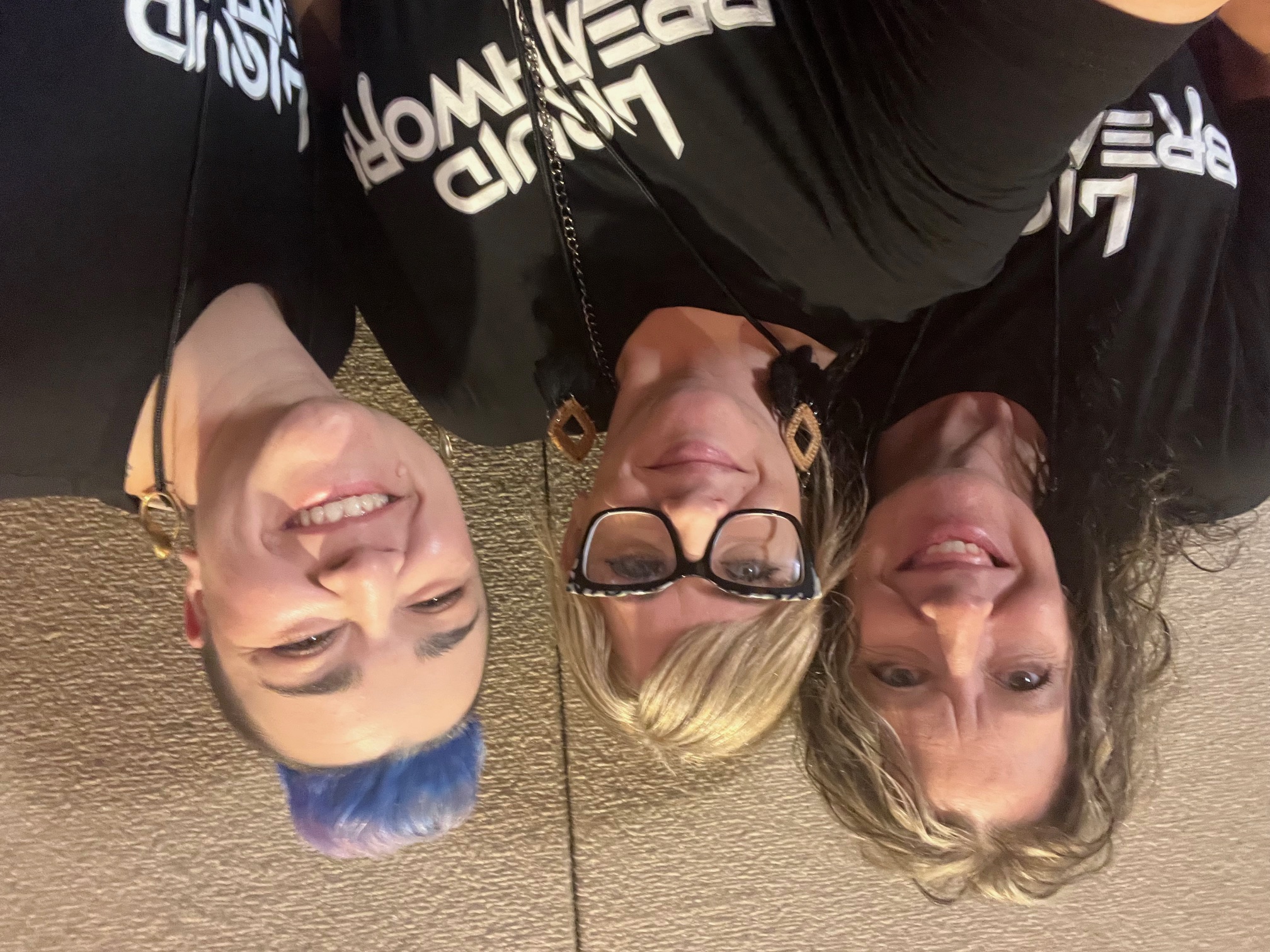 Liquid Breathwork certified facilitator graduates wearing branded shirts after completing teacher training